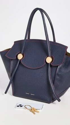 Proenza Schouler Grainy Leather Pipe Bag -Jacquemus Shop prosh20537197f0 1662654650743 2 0. UX357 QL90