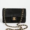 What Goes Around Comes Around Chanel Black Suede Vertical Flap 9"