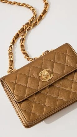 What Goes Around Comes Around Chanel Gold Half Flap Micro Bag -Jacquemus Shop wgadb3683511739 1681839231215 2 0. UX357 QL90