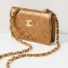 What Goes Around Comes Around Chanel Gold Half Flap Micro Bag -Jacquemus Shop wgadb3683511739 1682450008107 2 0. UX357 QL90
